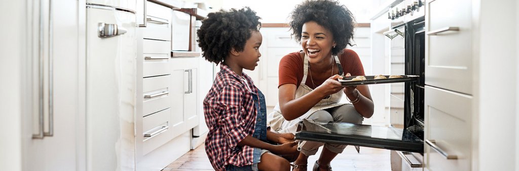 Mom and son baking in kitchen