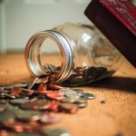 jar with coins spilling out