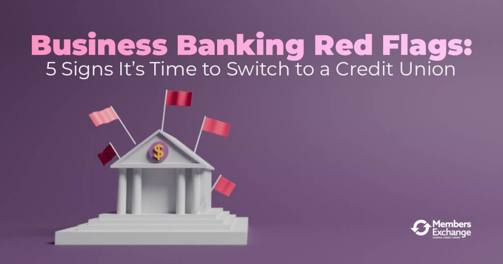Illustration of a traditional bank building with red flags, symbolizing warning signs in business banking, promoting the benefits of switching to a credit union.