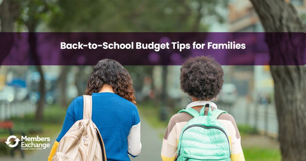 Parent and child reviewing back-to-school supplies and a family budget with MEFCU.